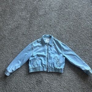 Light blue zip up denim jacket